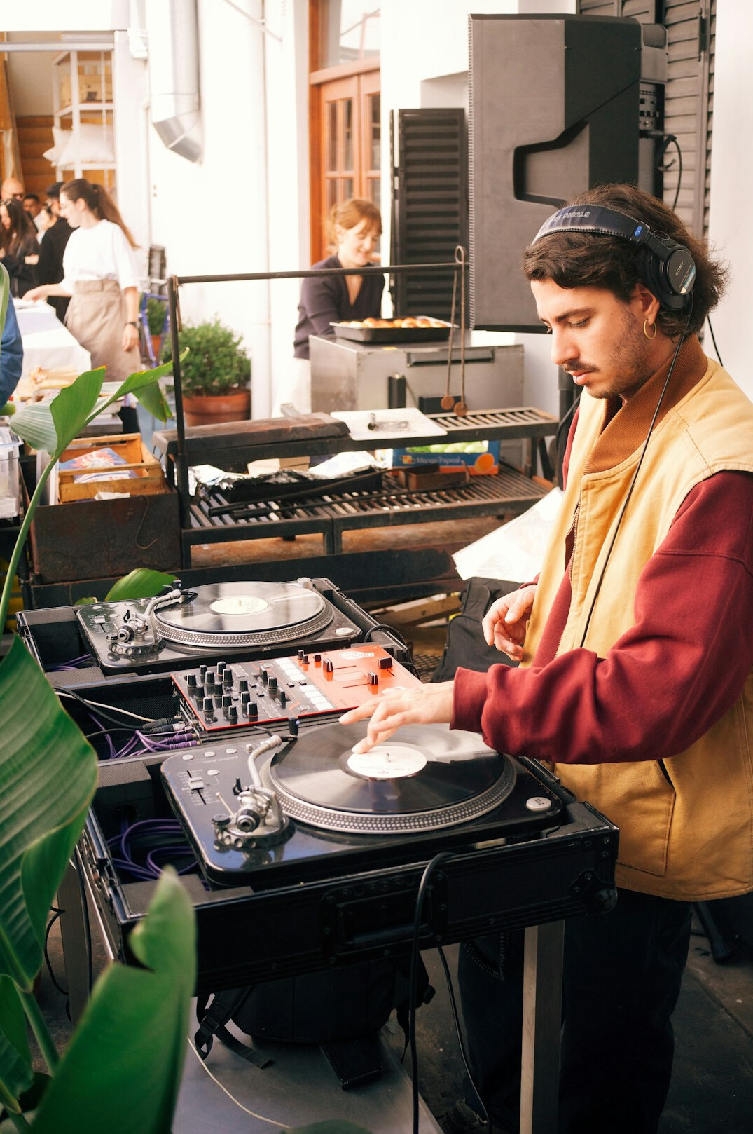 Technician setting up broadcast studio equipment