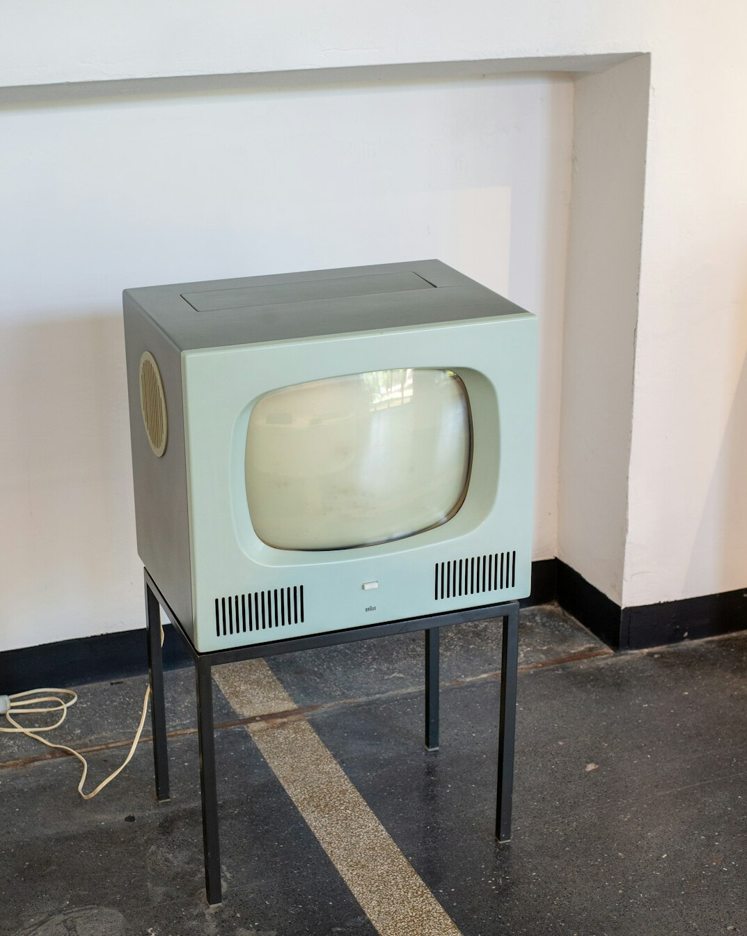 Boom microphone positioned over a TV set